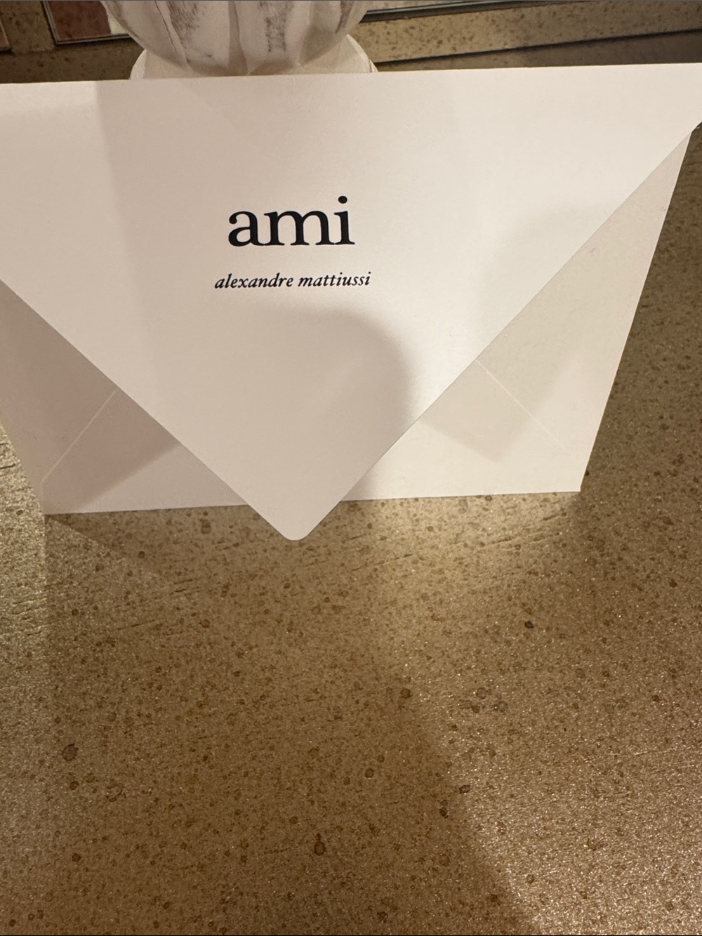 Ami White Envelope with Black Logo